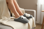 Lifestyle photo - sheep slippers on sofa